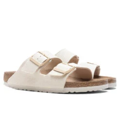 Birkenstock Women's Narrow Arizona Vegan - Eggshell -Birkenstock Store Birkenstock Women s Narrow Arizona Vegan Eggshell 1022679 05 29 22 Feature DV 2