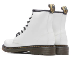 Dr. Martens Women's 1460 Patent Leather Boots - White Patent Lamper -Birkenstock Store Dr. Martens Youth 1460 Patent Leather Lace Up Boots Black 21979001 11 29 22 Feature JM 5